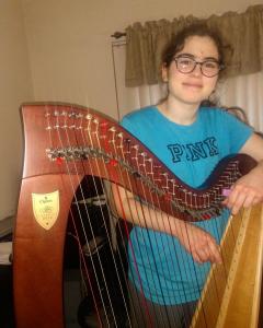 Jenna posing with her delivered harp
